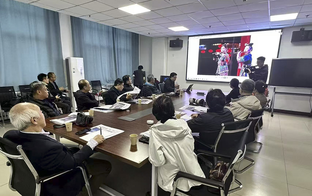 中國新聞攝影學(xué)會召開“新春走基層”活動總結(jié)會